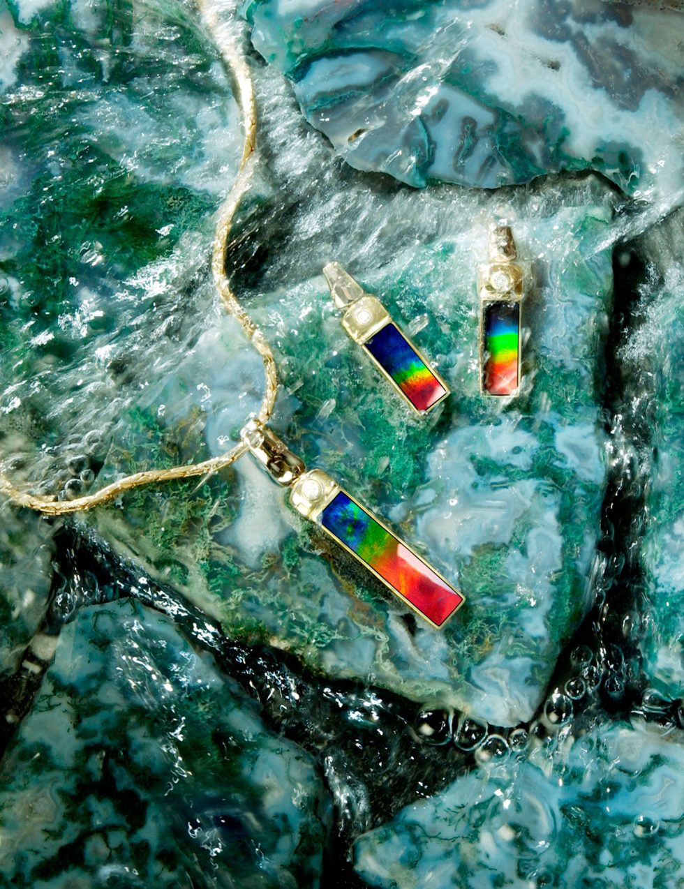 Calgary Product Photographer. Colourful jewellery with river rock back drop.